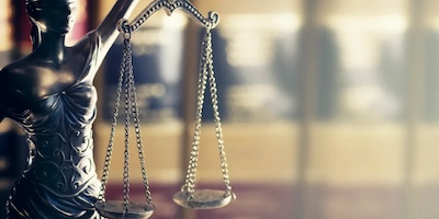 A statue of lady justice holding the scales.